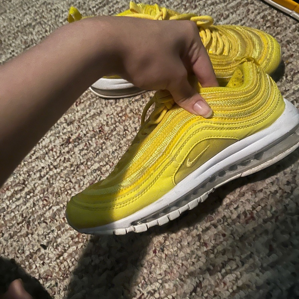 Yellow Nike shoes
